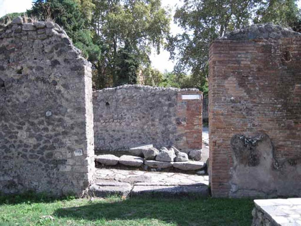 1.2.1 Pompeii. September 2010. Doorway in south wall of bar-room onto Vicolo del Conciapelle. Interior of doorway I.2.32, looking south onto Vicolo del Conciapelle. According to Fiorelli, on the right (west) of the doorway would have been the hearth. Photo courtesy of Drew Baker.