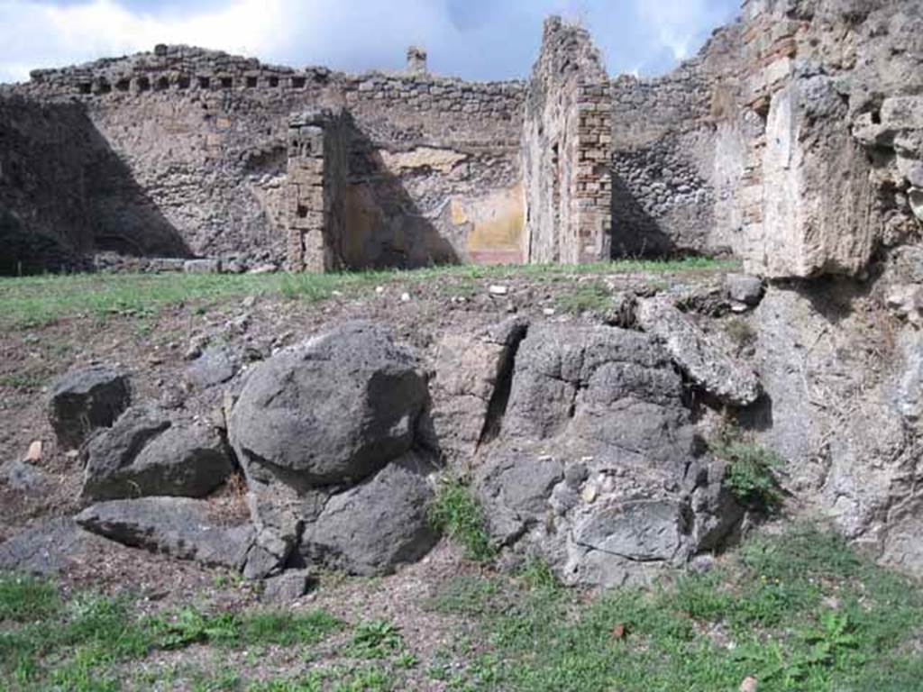 1.2.3 Pompeii. September 2010. Looking north in triclinium at site of north wall (and lava outcrop). Photo courtesy of Drew Baker.