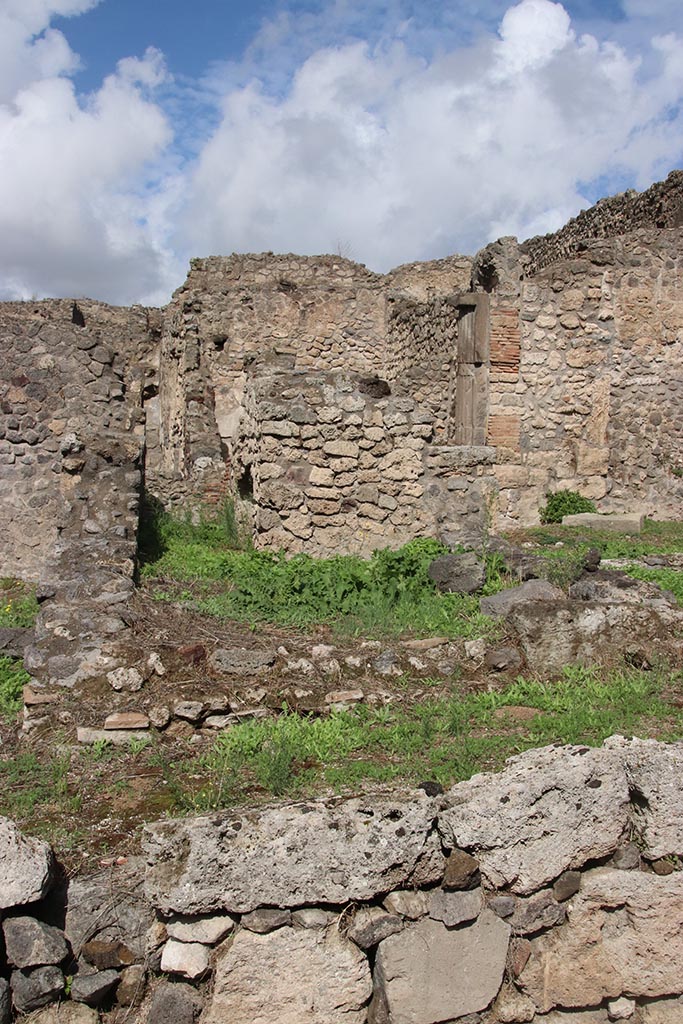 I.2.3 Pompeii. October 2024.
Looking north across remains of kitchen, towards north wall and stairs. Photo courtesy of Klaus Heese.