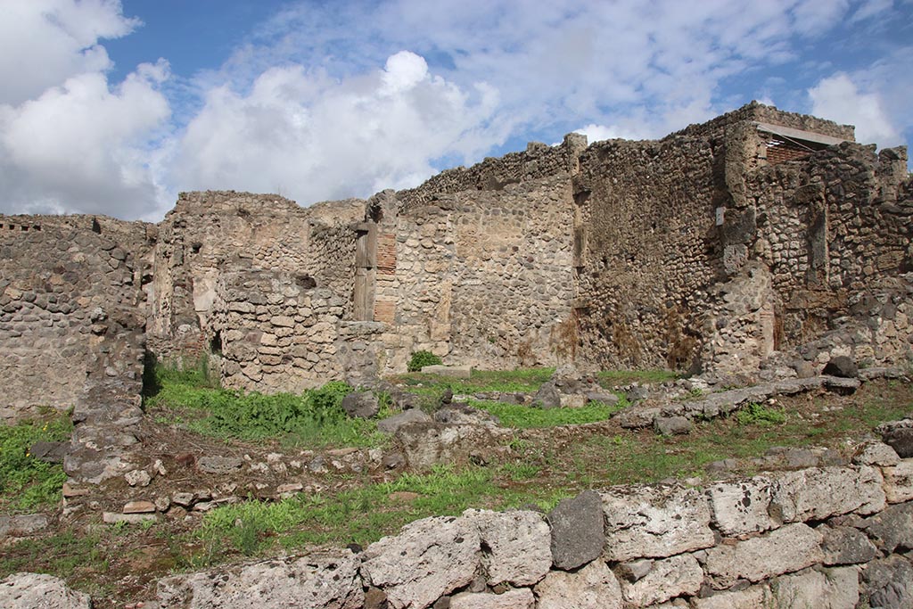 I.2.3 Pompeii. October 2024.
Looking north towards east wall of garden area, centre right.
On the right is the east wall of two rooms, one a storeroom and one a sacrarium. Photo courtesy of Klaus Heese.