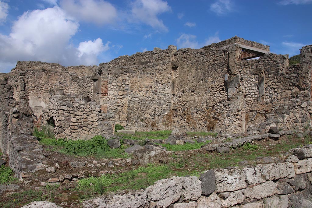 I.2.3 Pompeii. October 2024. Two rooms in the south-east corner at the rear of the house, on right.
Taken from side road, Vicolo del Conciapelle. Photo courtesy of Klaus Heese.