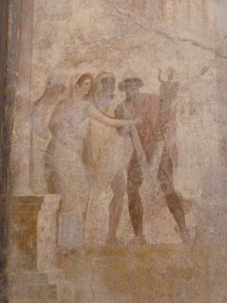 I.2.6 Pompeii. May 2010.
Detail from the wall painting of the Theft of the Palladium (Ratto del Palladio) found on the south wall of the triclinium.
Now in Naples Archaeology Museum, inventory number: 109751.
Detail of a group of people on the left of the painting, Etra (Aethra), Elena (Helen) with arm outstretched and Diomede (wearing a lion skin over his head).
Ulysses (Odysseus) is seen holding the Palladium, a statue of Athena, who would have protected the city of Troy, as long as she remained in the temple.