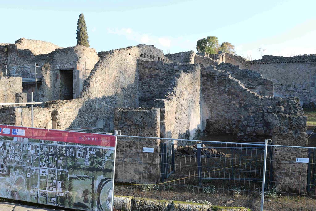 I.2.7 Pompeii. December 2018.
Looking east to entrance doorway, on right, with I.2.8, on left, behind screening. Photo courtesy of Aude Durand.