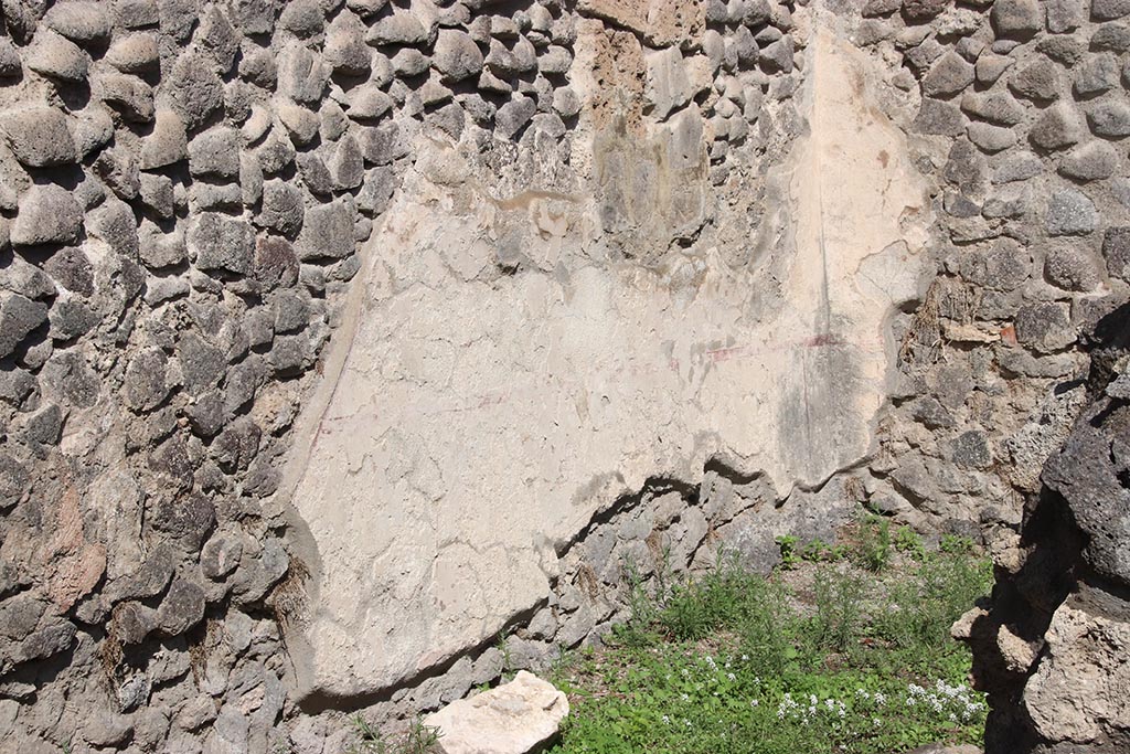 I.2.7 Pompeii. October 2024.
North wall of rear room in north-east corner, with outline of site of stairs in plaster, on left. Photo courtesy of Klaus Heese.