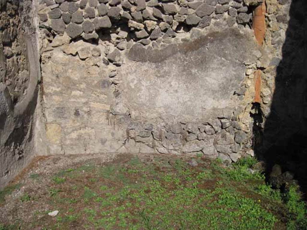 1.2.8 Pompeii. September 2010. Rear east wall in rear room, with down-pipe from upper floor. Photo courtesy of Drew Baker.