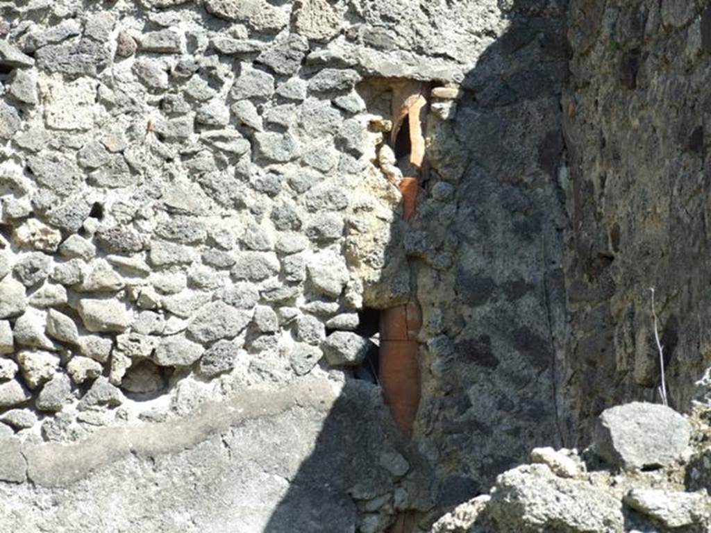 I.2.8 Pompeii. March 2009. Downpipe in south east corner of rear room.