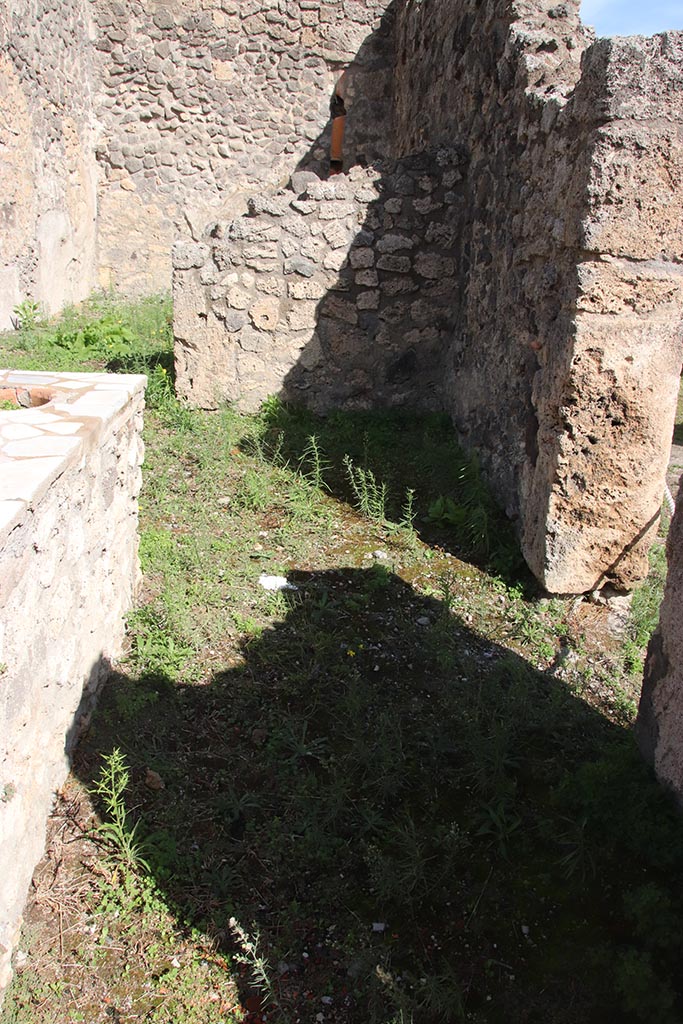 I.2.8 Pompeii. October 2024.
South-east corner of bar-room, with doorway into I.2.7 in south wall. Photo courtesy of Klaus Heese.