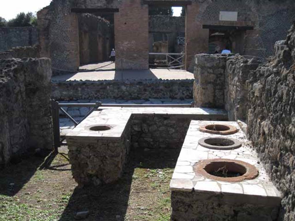 1.2.8 Pompeii. September 2010. Looking west across bar-room towards entrance doorway on Via Stabiana. Photo courtesy of Drew Baker.