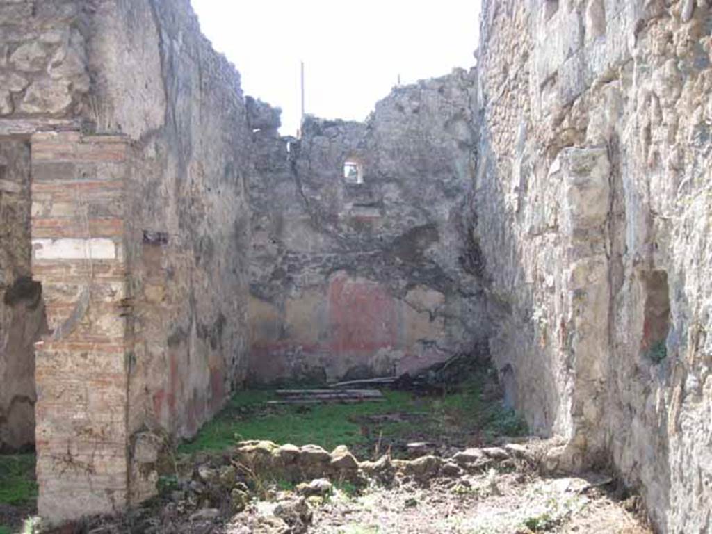 I.2.10 Pompeii. September 2010. Looking west from garden area, through window into triclinium. Photo courtesy of Drew Baker.