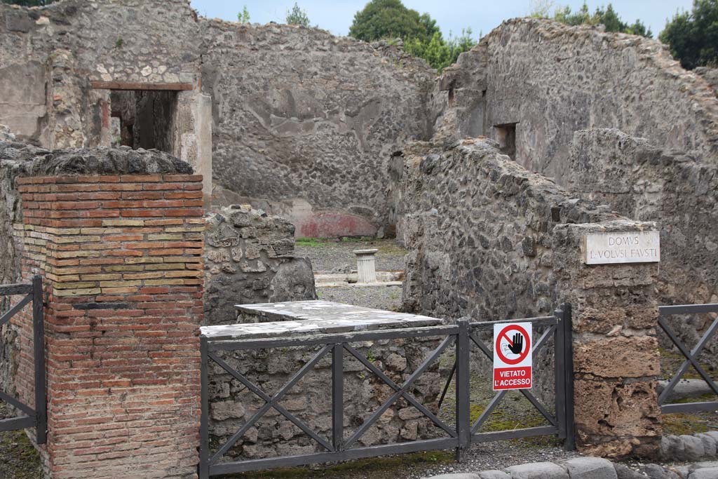 I.2.11 Pompeii, in centre. April 2014. Looking south-east towards entrance doorway.
On the right, is the entrance corridor of I.2.10, Domus of L & M Volusii Fausti, leading into the atrium.
Photo courtesy of Klaus Heese.
