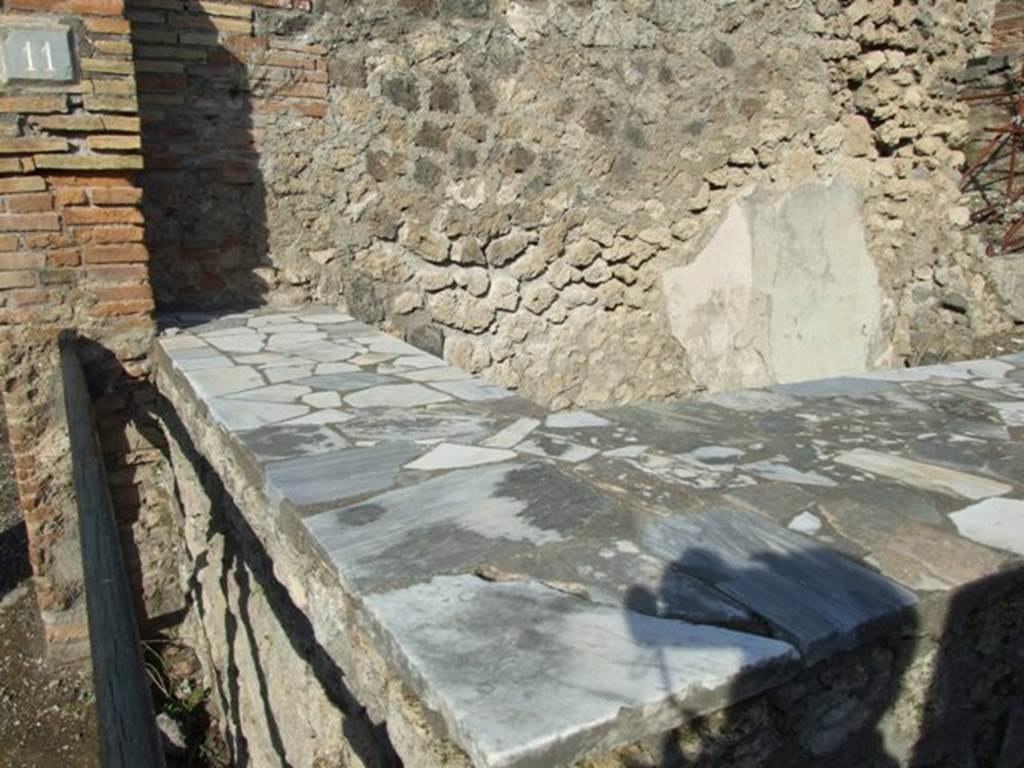 I.2.11 Pompeii. December 2007. Counter. This probably originally had three dolia in the top. See Van der Poel, H. B., 1986. Corpus Topographicum Pompeianum, Part IIIA. Austin: University of Texas. (p.4).