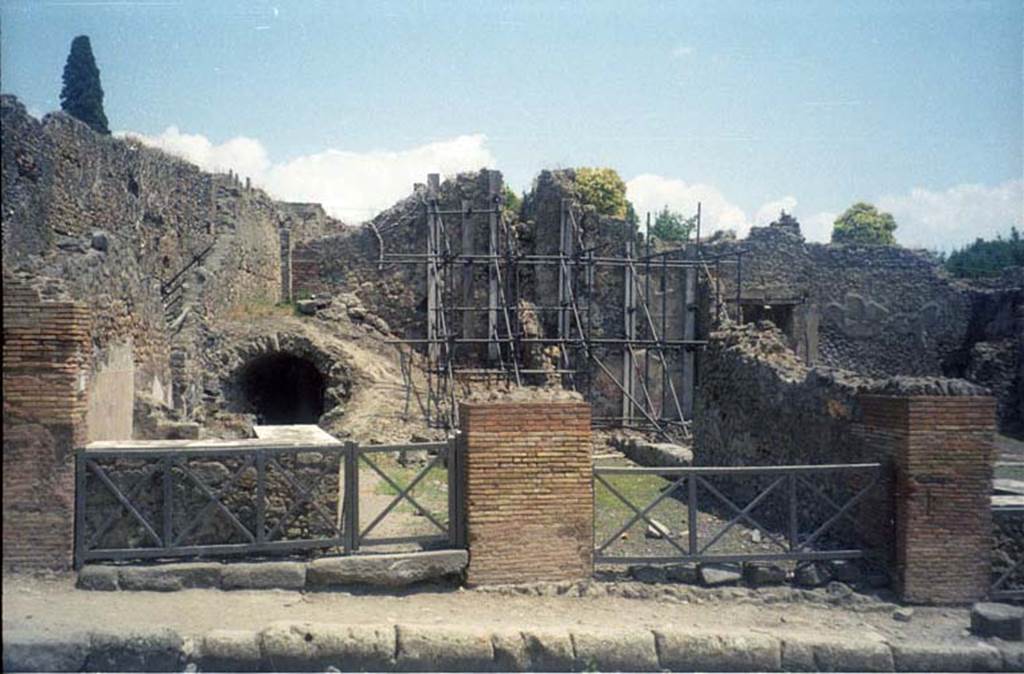 I.2.12 Pompeii. July 2011. Looking east to entrance doorway (on right) from Via Stabiana. Photo courtesy of Rick Bauer.
Warscher described this, quoting Fiorelli, as “I.2.12/13 – due taberne aventi comunicazione tra loro. Il podio è rivestito di marmi. Qui l’insula è delimitata dalla via secunda, sulla quale si aprono gl’ingressi di altre abitazioni”.
See Warscher T., 1935. Codex Topographicus Pompeianus: Regio I.2. Rome: DAIR.
(translation: "I. 2.12/13 - two workshops having communication between them. The podium was covered with marble. Here the insula is bounded by via secunda, on which opens the entrances of other dwellings.")