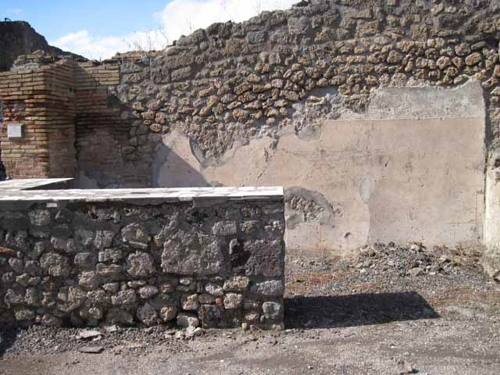 I.2.13 Pompeii. September 2010. North wall of the bar at the rear of counter. Photo courtesy of Drew Baker.