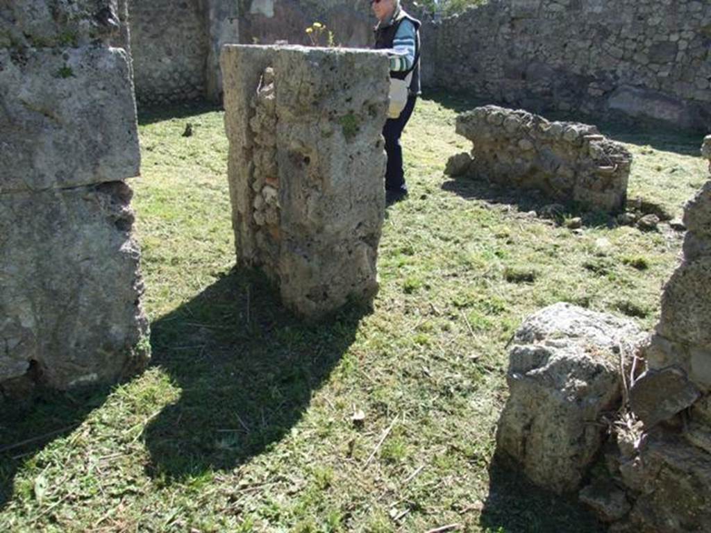 I.2.16 Pompeii. March 2009. Looking south-west from room 3, with small doorway to room 4 (on left), and doorway to east portico (on right).