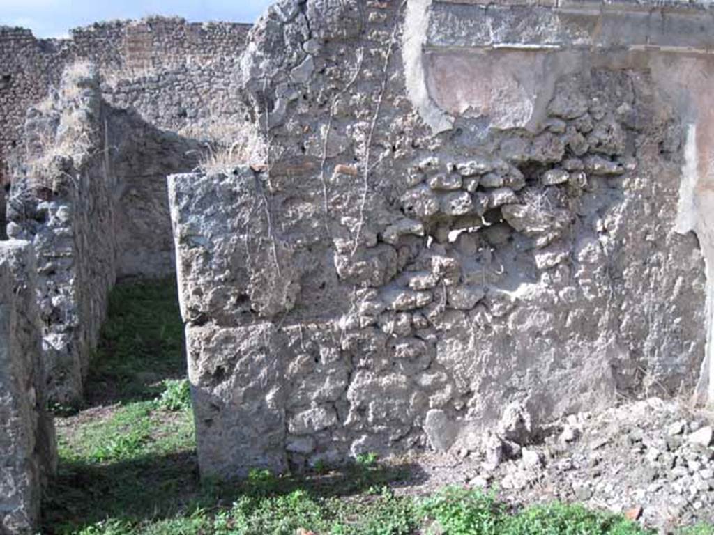 1.2.16 Pompeii. September 2010. North wall of room 4, with small doorway to room 3. Photo courtesy of Drew Baker.