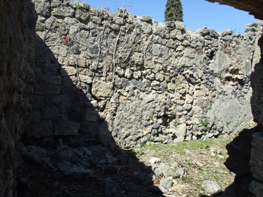 I.2.17 Pompeii. March 2009. Room 3, kitchen, with stairs to upper floor.
Corridor to storeroom or cupboard (on left) and north wall. The dividing wall between the storeroom and kitchen is missing.