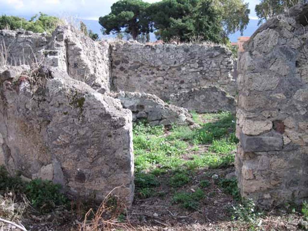 I.2.17 Pompeii. September 2010. South wall of room 4, with doorway into room 12. Photo courtesy of Drew Baker.