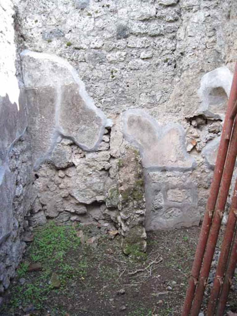 I.2.18 Pompeii. September 2010. Looking south into small room in south-east corner. Latrine and kitchen?
Photo courtesy of Drew Baker.
According to Fiorelli, the room with the latrine had a hollow in the wall for placing a lamp.
See Pappalardo, U., 2001. La Descrizione di Pompei per Giuseppe Fiorelli (1875). Napoli: Massa Editore. (p.36)
According to Boyce, in the south-west corner of the kitchen, built in a peculiar manner, was an arched niche.
(height 0.30m, w.0.30m, d.0.25m, height above the floor 1.30m).
See Boyce G. K., 1937. Corpus of the Lararia of Pompeii. Rome: MAAR 14. (p.22, no.12).
