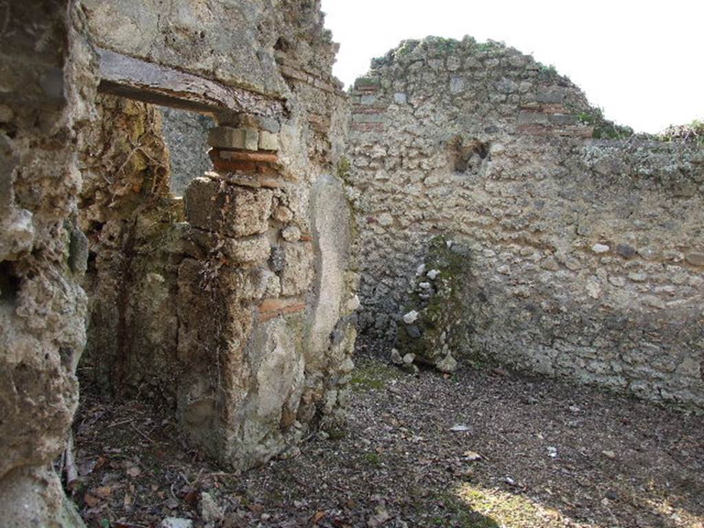 I.2.19 Pompeii. December 2006. Looking west from entrance towards doorways to two rear rooms on south side of bar.