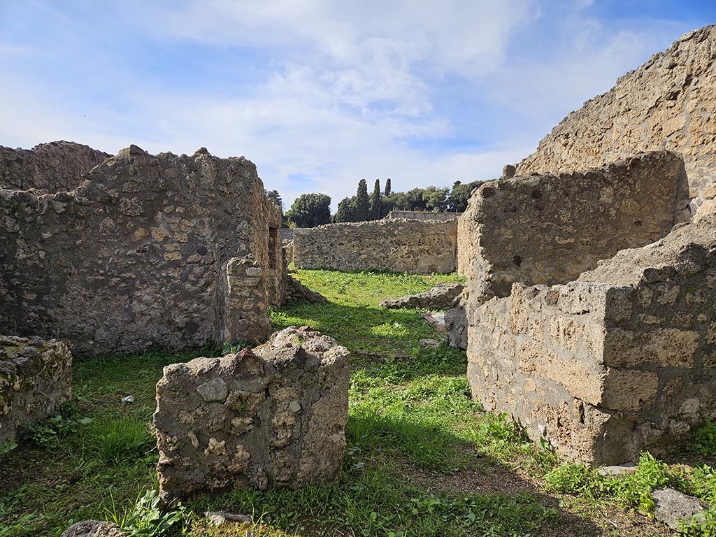 I.2.20 Pompeii. November 2024.
Looking west towards entrance doorway, on right. On the left is the entrance into I.2.21. Photo courtesy of Annette Haug.