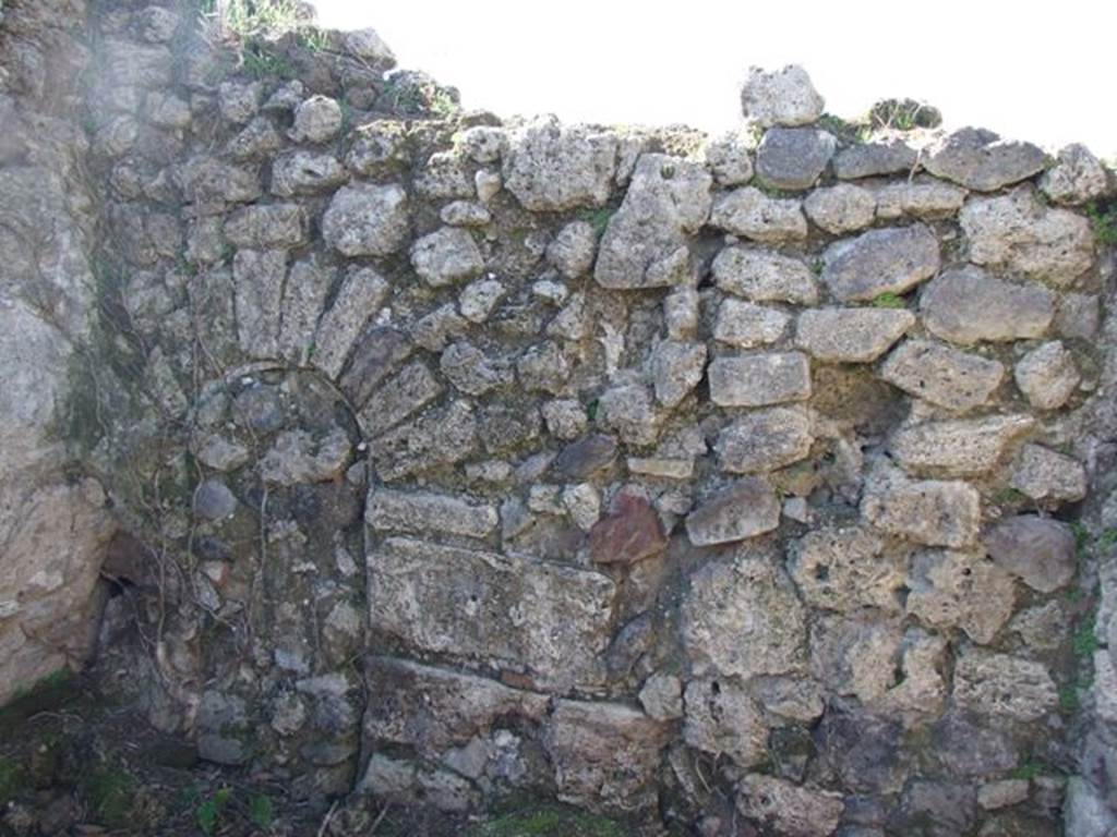 I.2.20 Pompeii. March 2009. West wall of kitchen area, with blocked archway to triclinium.