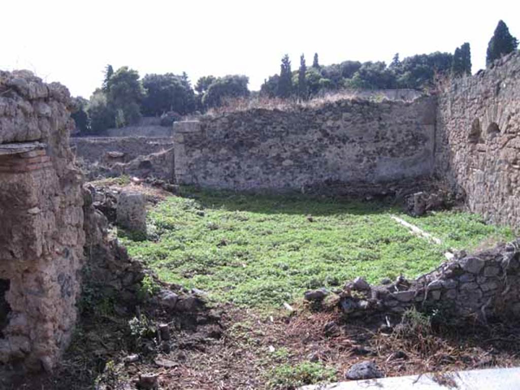 I.2.20 Pompeii. September 2010.
Looking west from small atrium towards garden area, with doorway to kitchen, on the left. Photo courtesy of Drew Baker.
