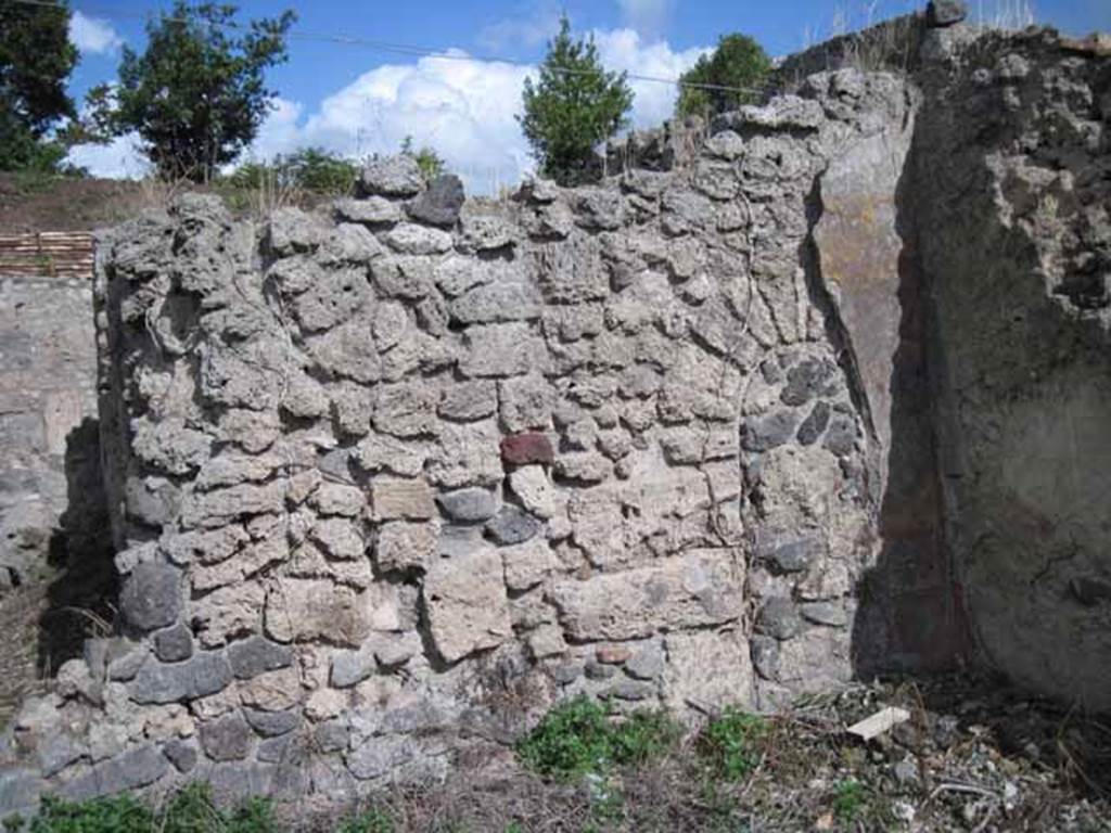 I.2.20 Pompeii. September 2010. East wall of triclinium, with blocked archway to kitchen room. Photo courtesy of Drew Baker.