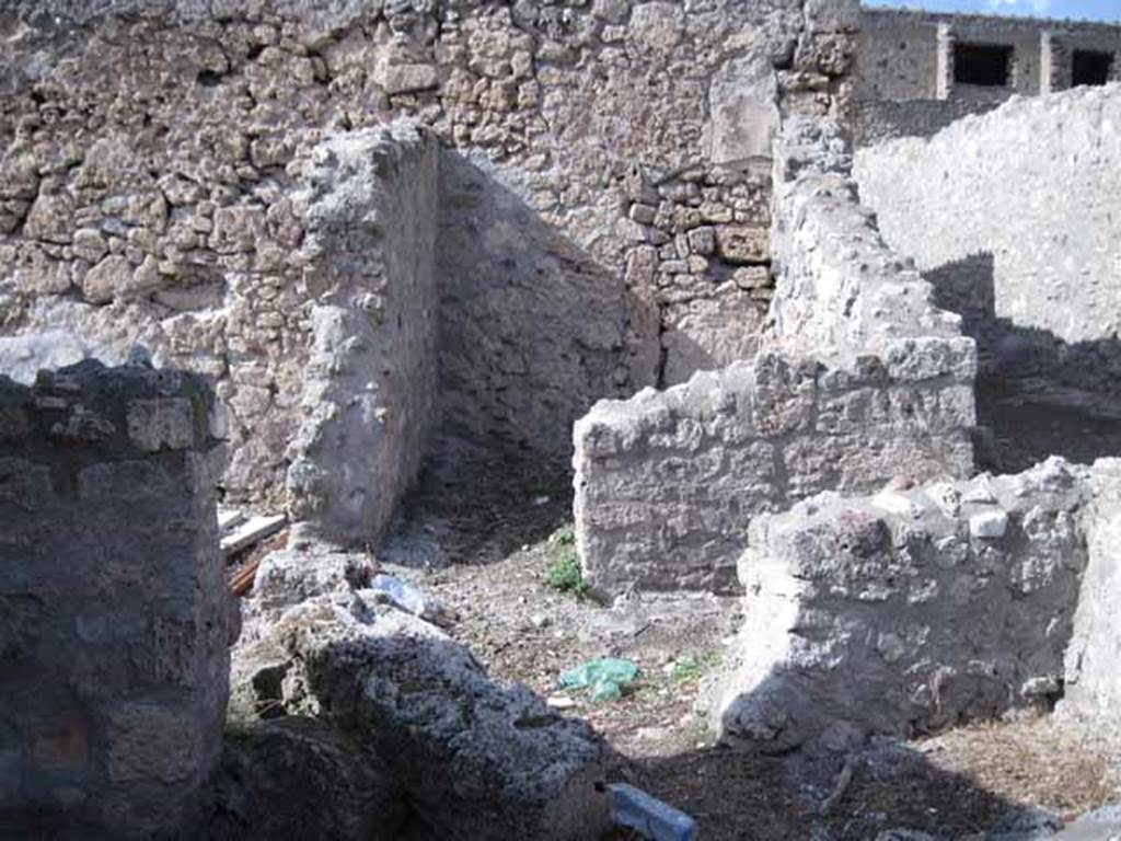 I.2.21 Pompeii. September 2010. Looking north from bar, across entrance corridor of I.2.20 to small room on north side. Photo courtesy of Drew Baker.