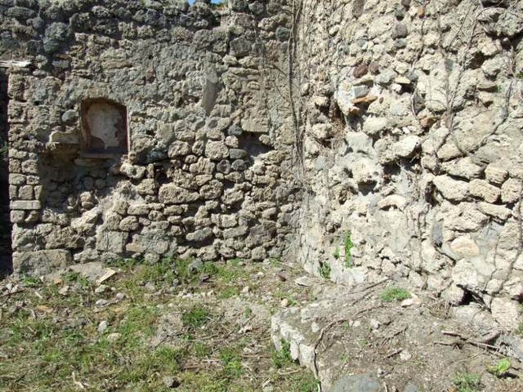 I.2.22 Pompeii. March 2009. Room 1. North east corner of Shop, with remains of stairs to upper floor, and niche.