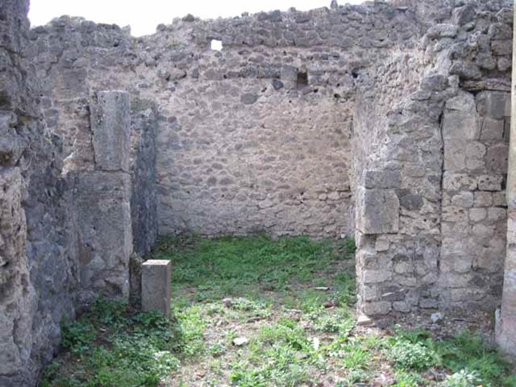 I.2.24 Pompeii. September 2010. Doorway to room in south-west corner of atrium, linked to I.2.25, looking west. Photo courtesy of Drew Baker.

