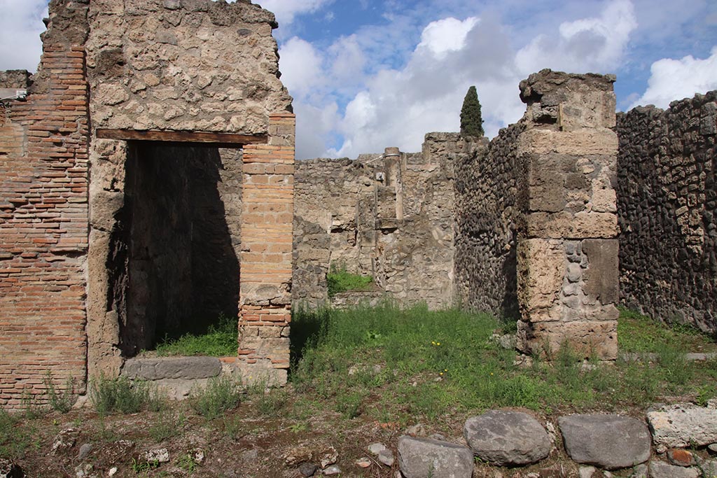 I.2.26 Pompeii. October 2024.
Looking north towards entrances to I.2.26 on left, I.2.25 in centre, and I.2.24 on right. Photo courtesy of Klaus Heese.