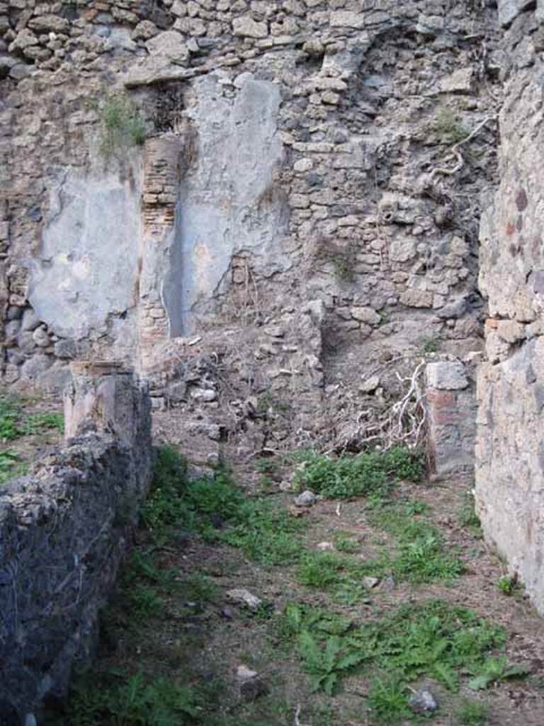 I.2.28 Pompeii. September 2010. Looking east along south portico.
Photo courtesy of Drew Baker. According to Jashemski, the peristyle garden (excavated 1873-4) had a portico along the east side and part of the south. Three stuccoed brick columns and two engaged ones which supported the portico were joined by a low wall. The columns were red up to the height of the low wall, white above. See Jashemski, W. F., 1993. The Gardens of Pompeii, Volume II: Appendices. New York: Caratzas. (p.25)
According to CTP, this house suffered badly from the earthquake of 1980, so many of its earlier features have been lost. See Van der Poel, H. B., 1986. Corpus Topographicum Pompeianum, Part IIIA. Austin: University of Texas. (p.4)