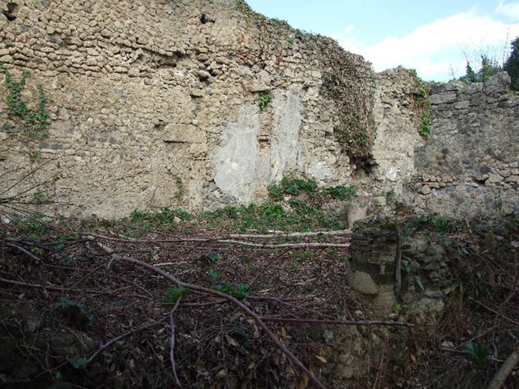 I.2.28 Pompeii. December 2006. Looking north east from south side of peristyle. Entrance into garden, with remains of one column and low wall.