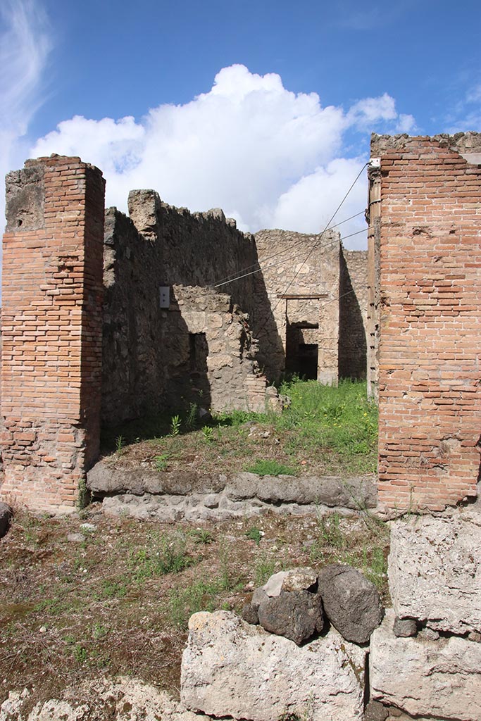 I.2.29 Pompeii. October 2024. 
Looking north towards entrance doorway. Photo courtesy of Klaus Heese.
The north wall would have connected to the atrium of I.2.28 by a doorway.
