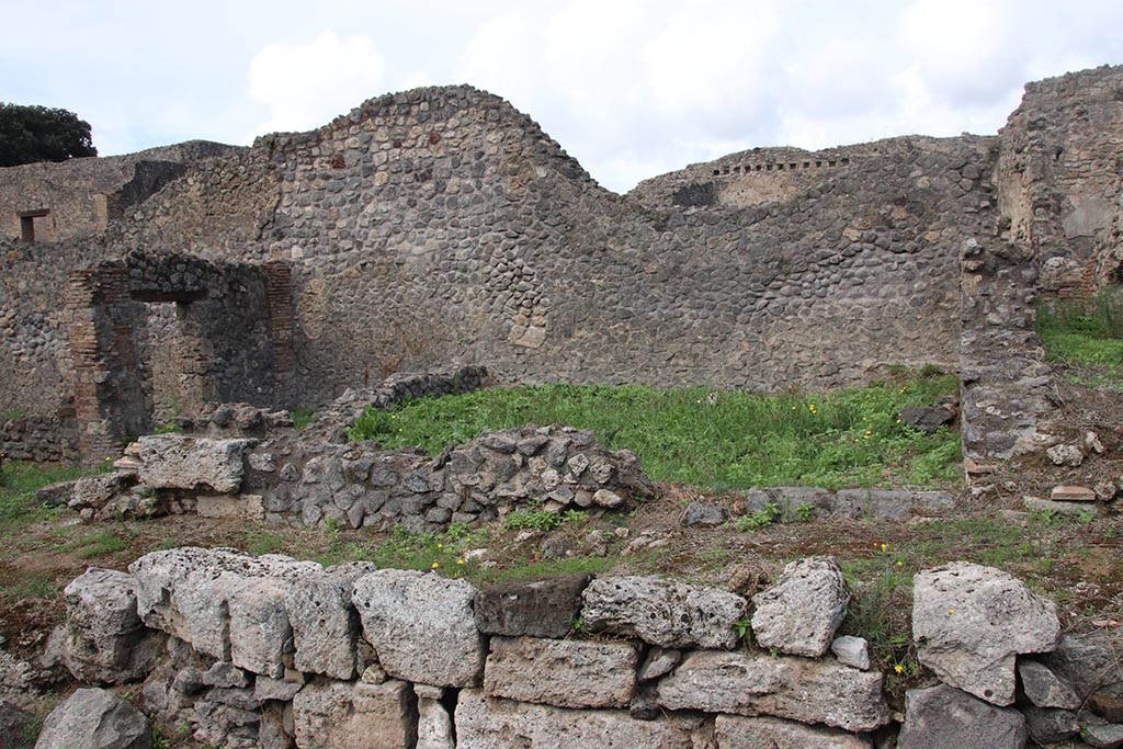 I.2.30 Pompeii. October 2024.
Looking north on Vicolo del Conciapelle towards entrance doorway into room on east side of I.2.31, with I.2.32 and I.2.1, on left.
Photo courtesy of Klaus Heese.