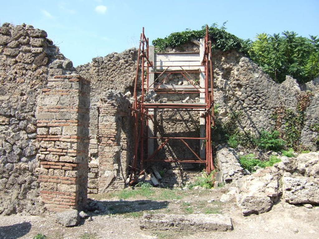 I.2.31 Pompeii. September 2005. Looking north into rear room of caupona at 1.2.1, with the remains of entrance cill or doorway. Painted near to the entrance on the brick construction, according to Fiorelli, was -
CELSVMAED
O.V.F
See Pappalardo, U., 2001. La Descrizione di Pompei per Giuseppe Fiorelli (1875). Napoli: Massa Editore. (p.34)