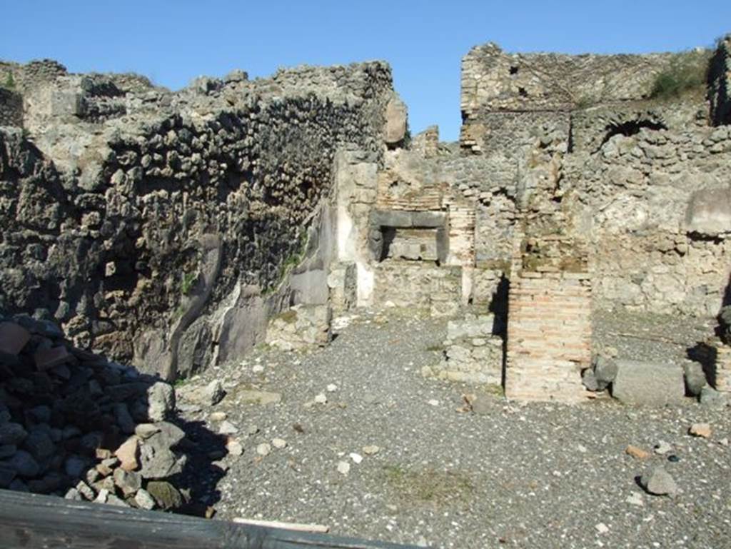 I.3.1 Pompeii. March 2009. North side of bakery shop, with site of steps to upper floor and oven in north east corner.