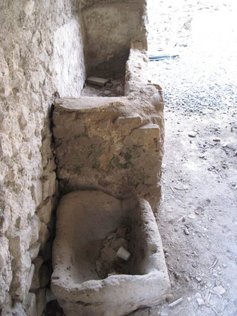 I.3.3 Pompeii. September 2010. Looking north along west wall of kitchen showing detail of bowl and basin. Photo courtesy of Drew Baker.