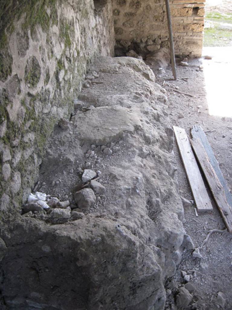 I.3.3 Pompeii. September 2010. Looking south along east wall with detail of table or bench.
Photo courtesy of Drew Baker.