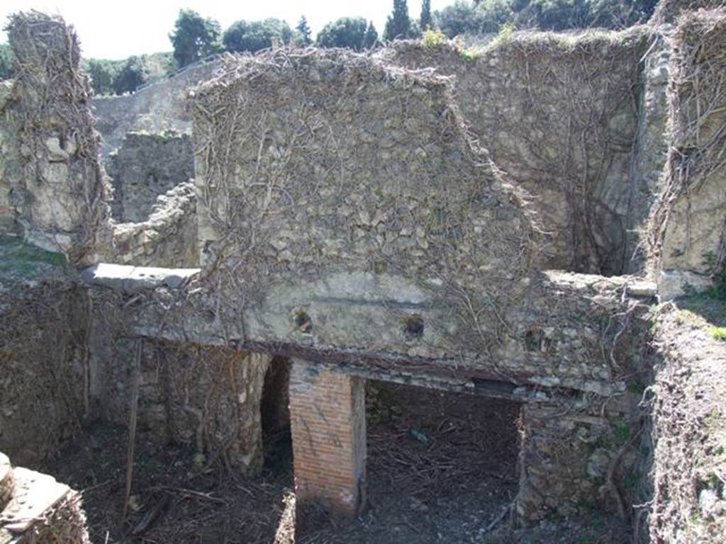 1.3.3 Pompeii. March 2009. West Portico area, and doorway to top of staircase, on upper left. On the upper right is a doorway to room in north-west corner of peristyle which, according to Mau, was ruined when excavated. This room would have been above the yard room in the subterranean level. See Mau, A: BdI, 1874 (p.183)