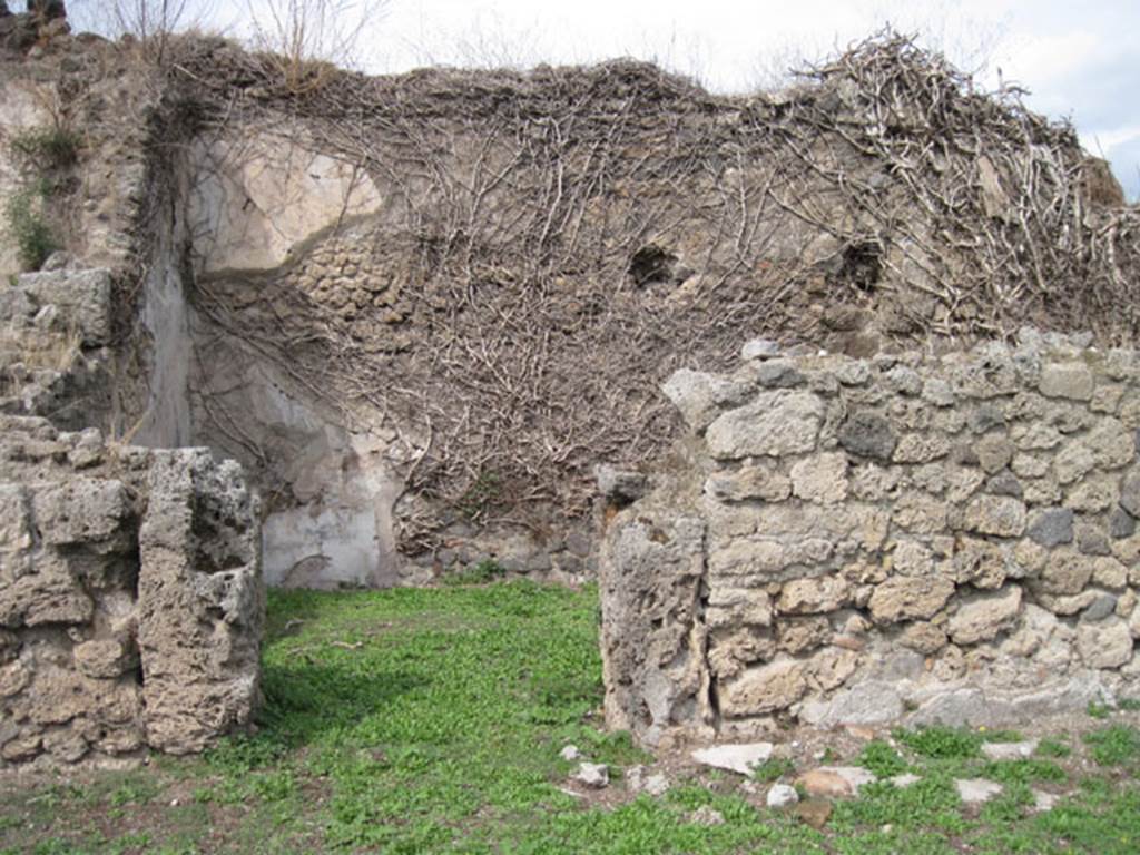 I.3.3 Pompeii. September 2010. Upper peristyle area, looking north to doorway to another oecus, which Fiorelli described as “occupying nearly all of the left (north) side of the peristyle”. Photo courtesy of Drew Baker.