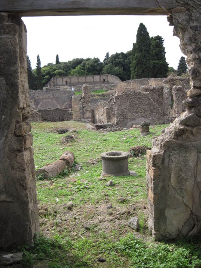 I.3.3 Pompeii. September 2010. Upper peristyle area, looking west through doorway from cubiculum onto east portico. Photo courtesy of Drew Baker.