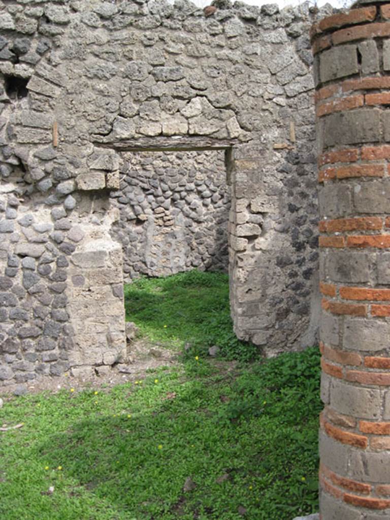 I.3.3 Pompeii. September 2010. Upper peristyle area, looking east towards doorway to large kitchen in south-east corner of upper peristyle. Photo courtesy of Drew Baker.