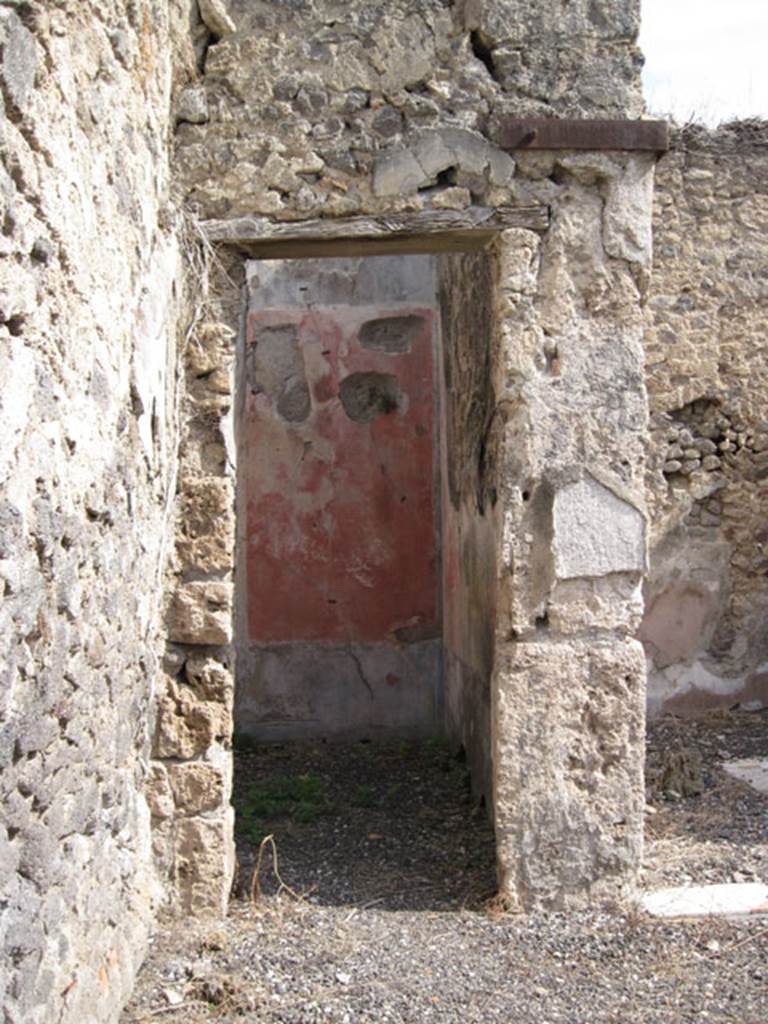 I.3.3 Pompeii. September 2010. Looking east towards doorway in north-east corner of atrium. Photo courtesy of Drew Baker.
According to Fiorelli, this doorway led to the triclinium, the walls were simply decorated.
Each wall was divided into three compartments, two painted red and one yellow. These walls were adorned with pictures of fish and fruit.
See Pappalardo, U., 2001. La Descrizione di Pompei per Giuseppe Fiorelli (1875). Napoli: Massa Editore. (p. 38)
See BdI, 1874, p.178.