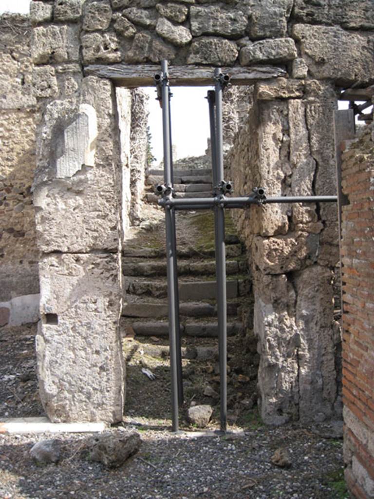 I.3.3 Pompeii. September 2010. Looking east from the south-east corner of the atrium towards tufa staircase to upper level. Photo courtesy of Drew Baker.