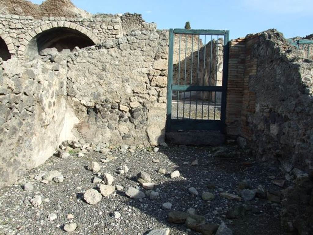 I.3.4 Pompeii. December 2007. East wall of shop, with doorway at rear of shop connecting to atrium of I.3.3.