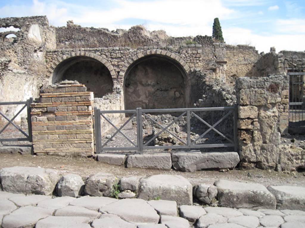 I.3.5 Pompeii. September 2010. Looking east towards entrance doorway from across the Via Stabiana. Photo courtesy of Drew Baker.
According to Warscher, quoting Fiorelli, she wrote –
I.3.5/6 – “Sono due tabernae in relazione tra loro, e perciò appartenute ad un stesso padrone. Entrambe hanno un primo compreso, separate da altro più interno, per un muro in cui è un’ampia finestra, onde ciascuno di essi prendeva luce: entrambe erano coverto da volte, di cui rimane solo la parte più interna. La prima ha nel mezzo un banco o podio di fabbrica, l’altra tiene accanto una cella, che sembra un dormitorio.”
(translation: "These were two linked workshops joined with each other, and therefore belonged to the same owner. Both had a front shop-room, separated by other more internal rooms, and by a wall in which was a wide window, so each room one took light from it: both were covered by a vault, but only the innermost part remained. In the middle of the first (I.3.5) was a masonry table or podium, the other had a room, which seemed to be a dormitory."
See Warscher, T, 1935: Codex Topographicus Pompejanus, Regio I, 3: Rome, DAIR.