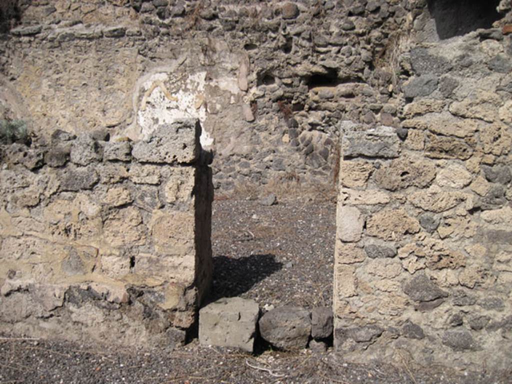 I.3.5 Pompeii. September 2010. North wall of rear vaulted room with doorway into a rear room. This room now appears to be part of I.3.6, as the north and west wall have disappeared. Photo courtesy of Drew Baker.