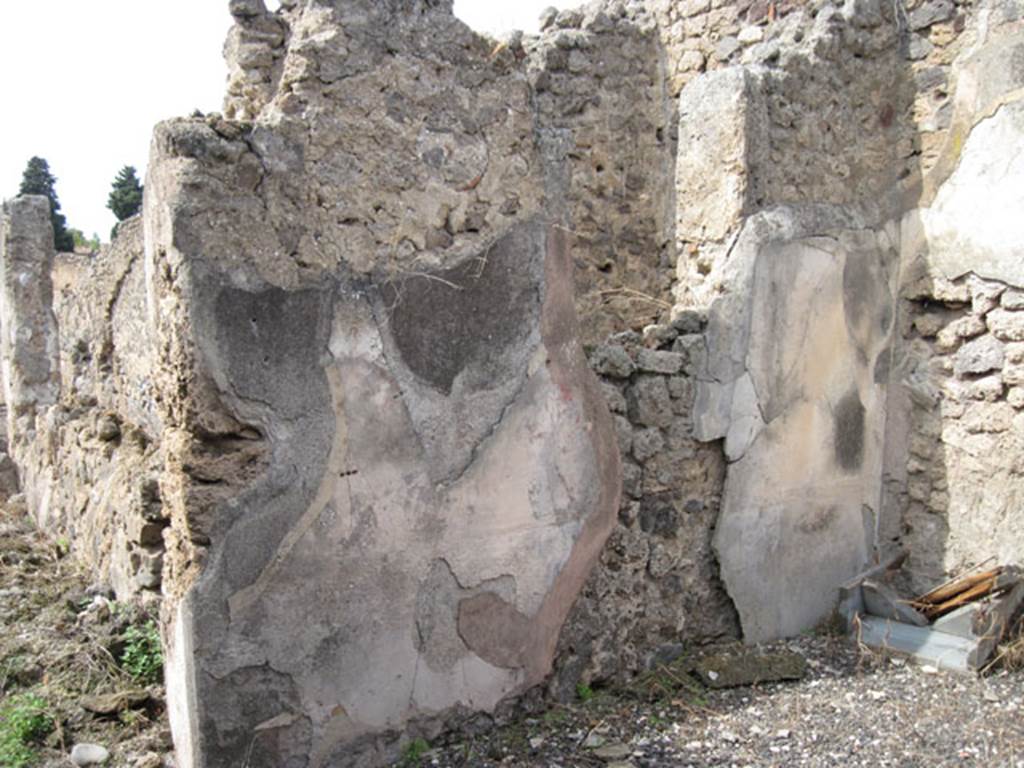 I.3.8b Pompeii. September 2010. West wall and north-west corner of triclinium, with window into the small room on its west side. Photo courtesy of Drew Baker.