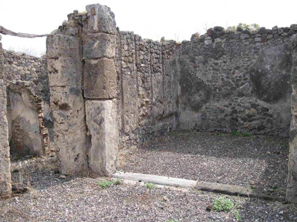I.3.8b Pompeii. September 2010. Looking towards doorway and oecus in south-east corner of peristyle. Photo courtesy of Drew Baker.